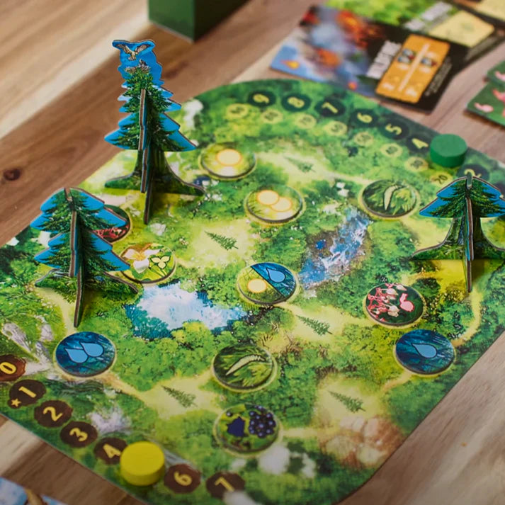 Canopy Board game with forest-themed board and player tokens on a wooden table