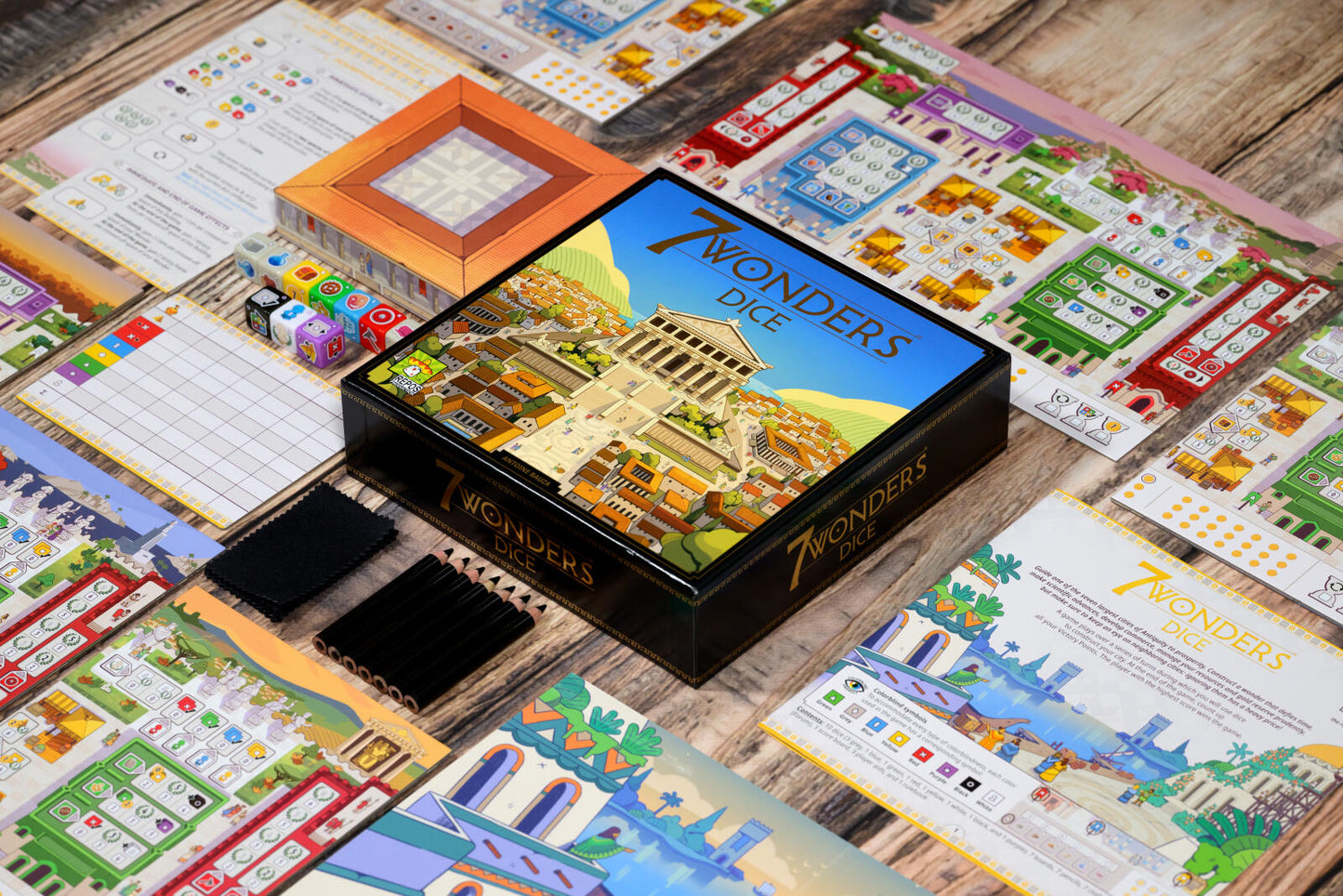 Board game box for '7 Wonders' on a wooden surface with game components.