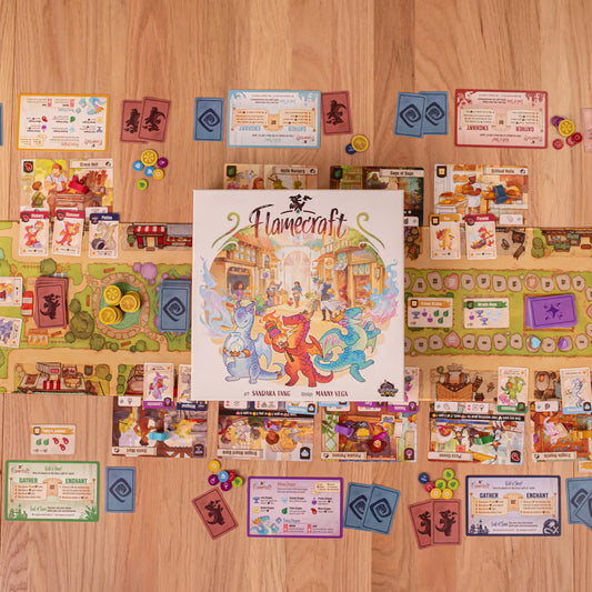 Board game 'Flamecraft' with cards and pieces on a wooden surface