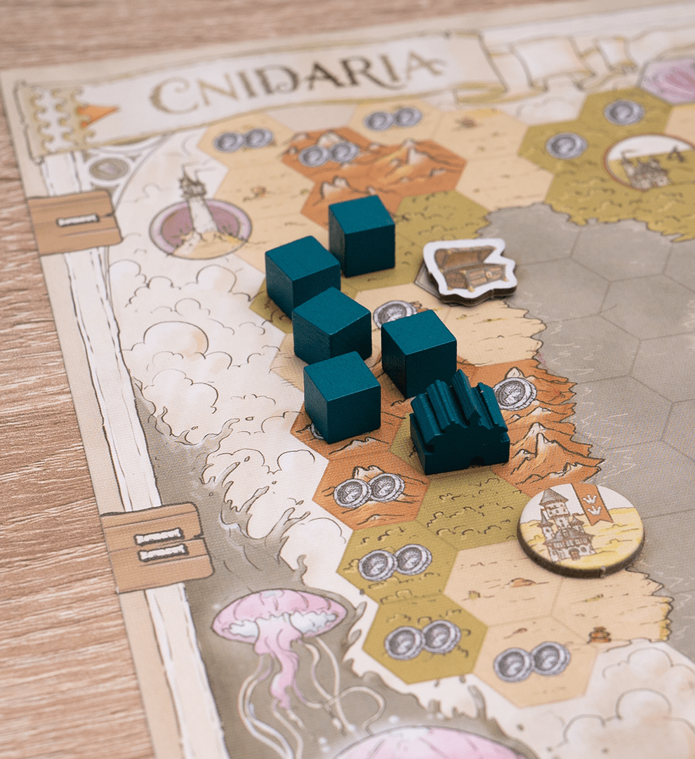 Board game piece on a map with 'Cnidaria' branding