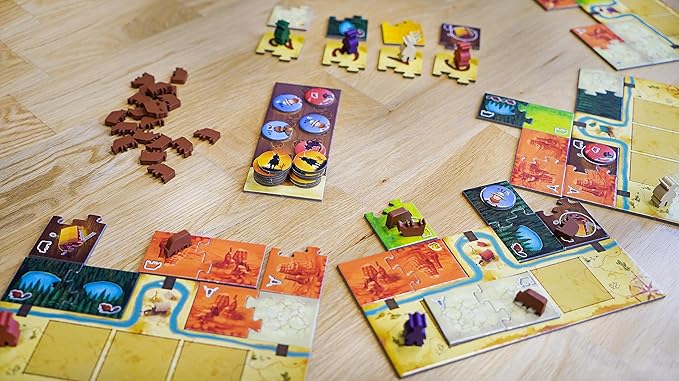 Moon River Board game pieces and cards on a wooden surface
