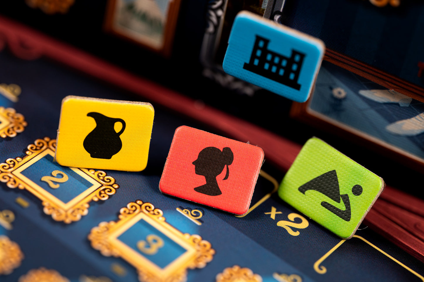 Colorful game pieces from Art Society with symbols on a board game