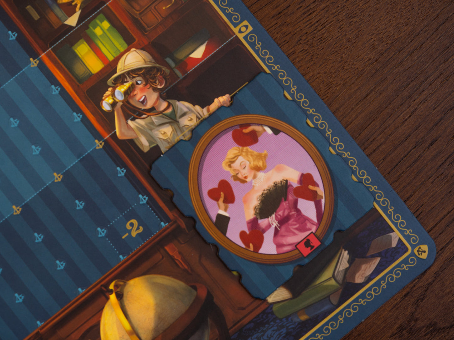 Art Society Close-up of a vintage-style card with a character and a framed picture on a wooden surface.