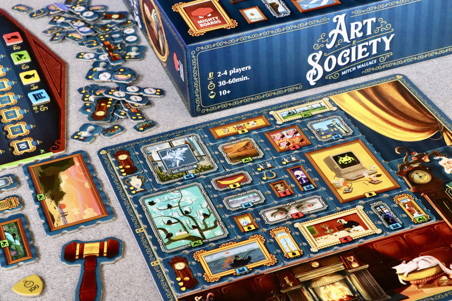 Board game 'Art Society' with pieces and box on a table