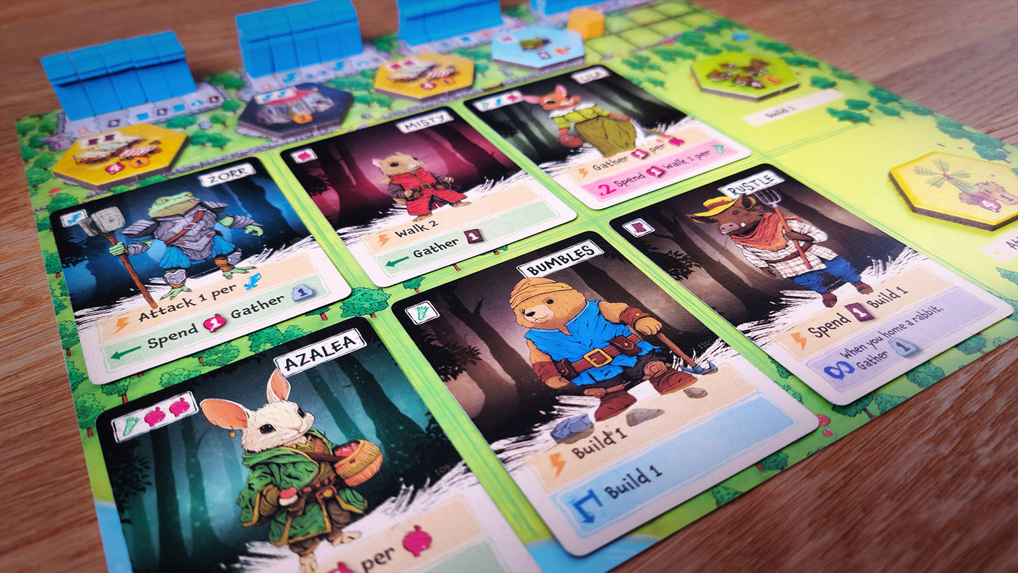 Board game Ember leaf cards with characters and text on a green play mat