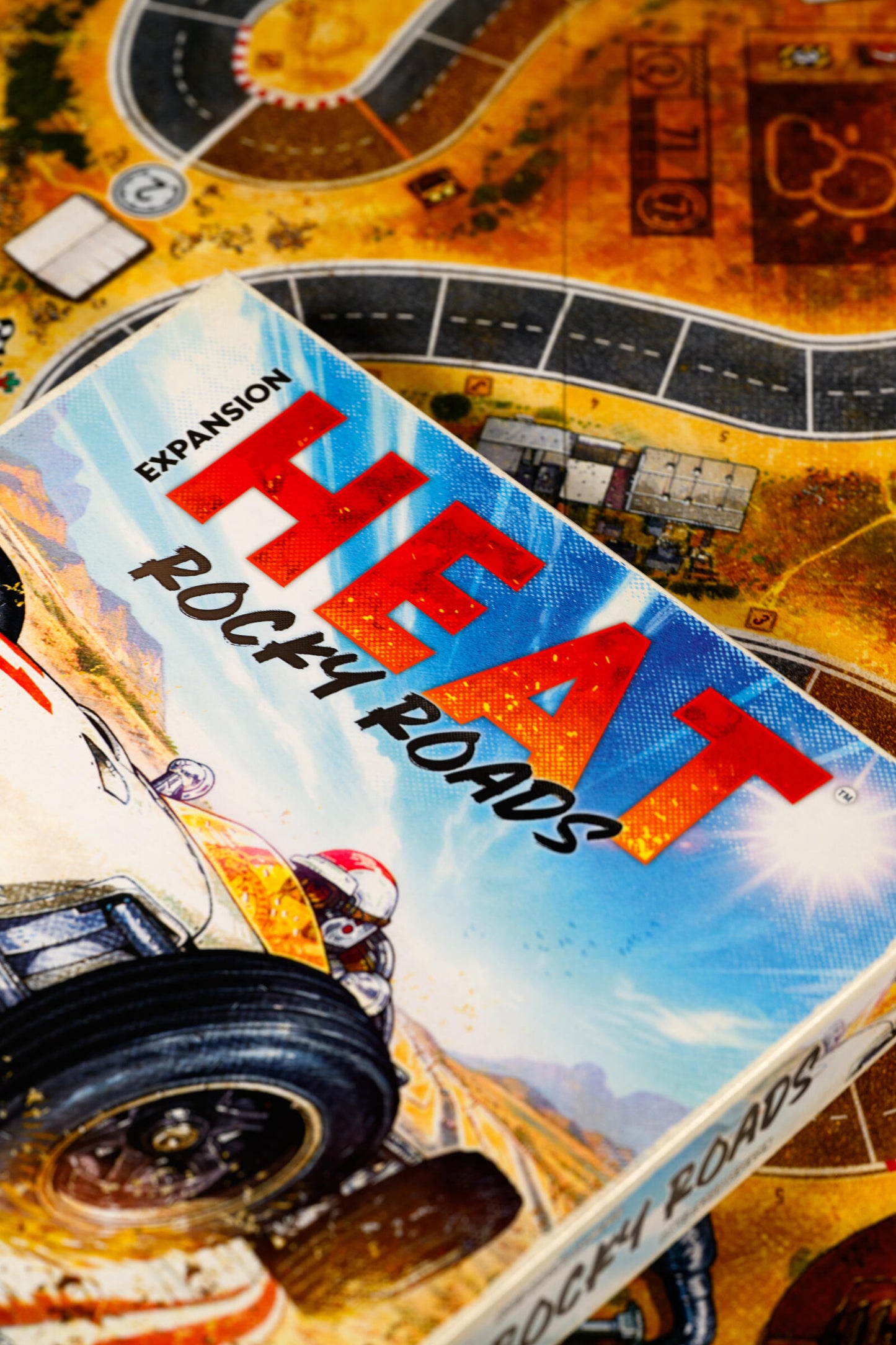 Board game expansion pack for 'HEAT' titled 'Rocky Roads' on a game board.