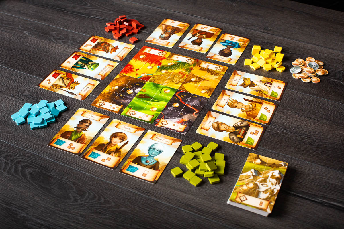 Roam Board game setup with cards and game pieces on a wooden surface