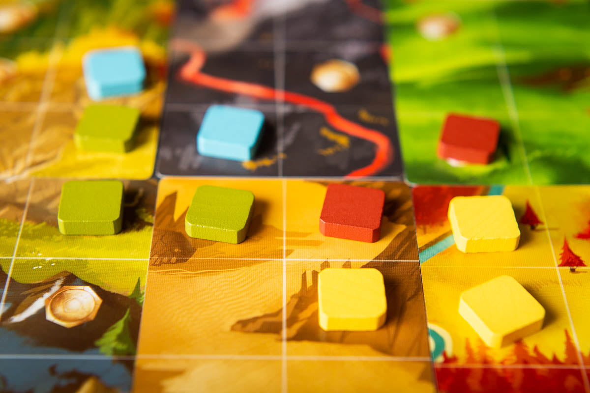 Roam Board game with colorful hexagonal tiles on a map