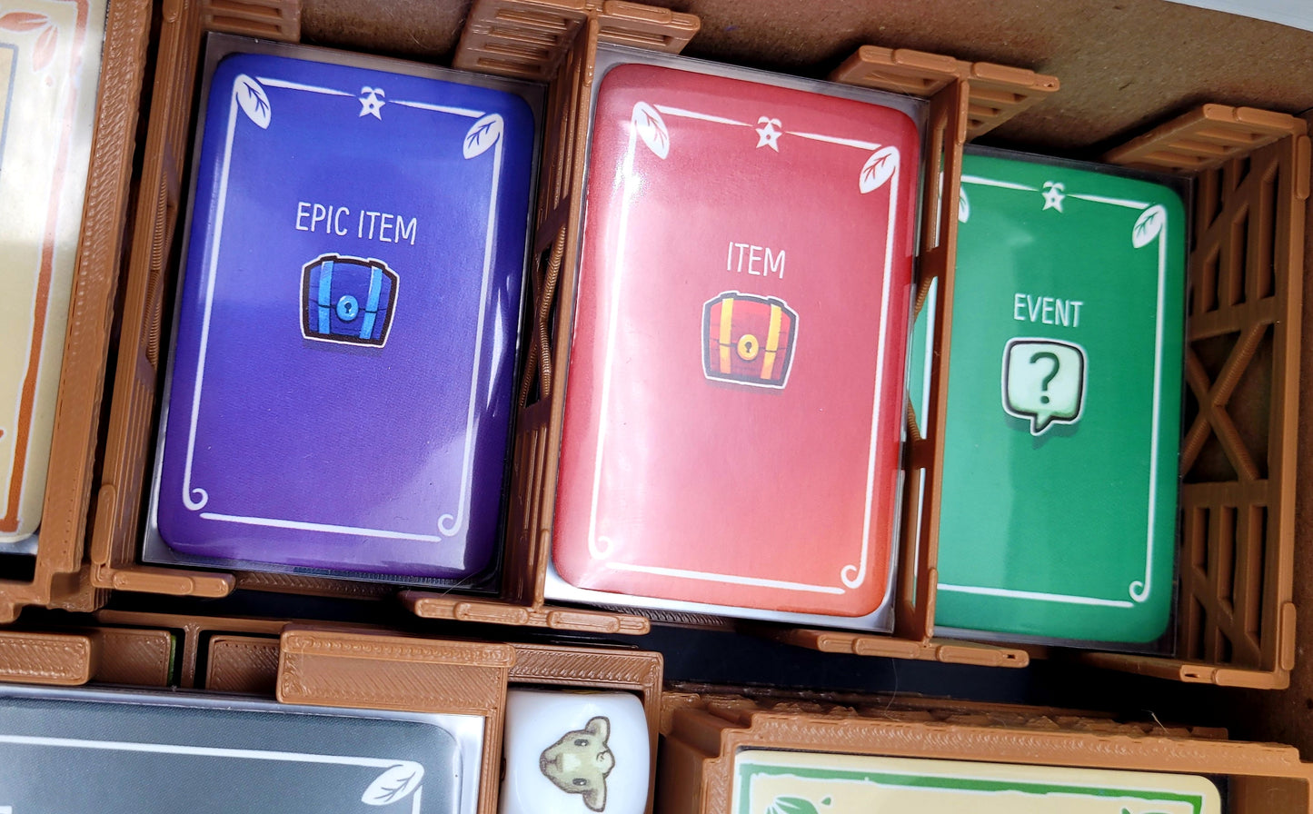 Sleeved cards in Stardew Valley board game organizer