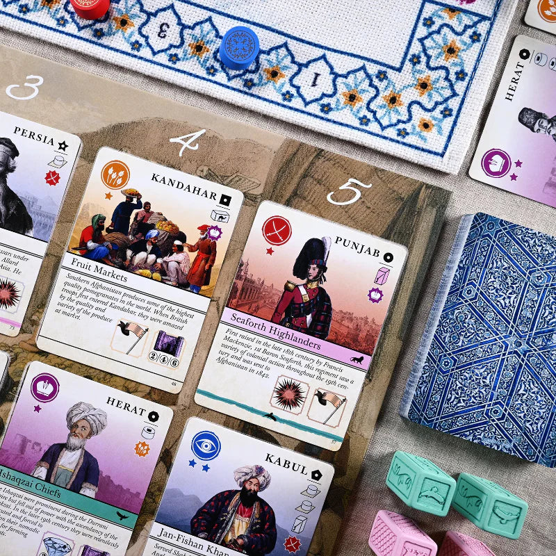 Pax Pamir Board game cards with illustrations and text on a wooden board