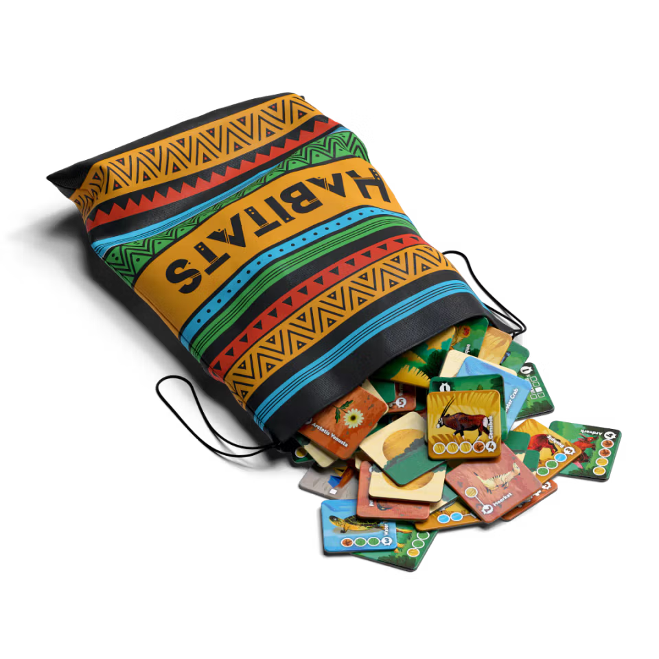 Colorful drawstring bag with 'HABITATS' on top, containing various cards on a white background