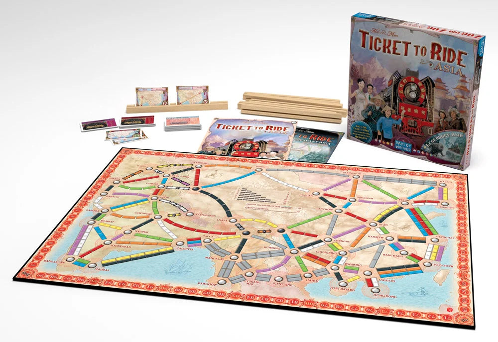 Board game set with 'Ticket to Ride' components on a white background