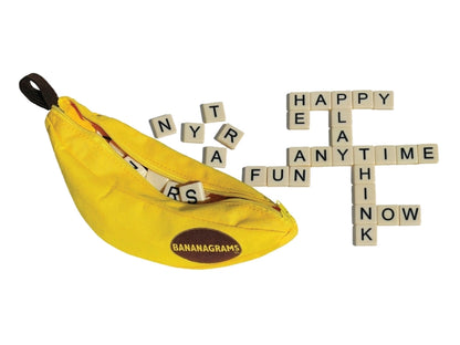 Yellow bag with Bananagrams branding and scattered tiles spelling out words on a white background