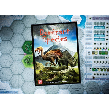 Board game box titled 'Dominant Species' on a hexagonal tile mat with game components.