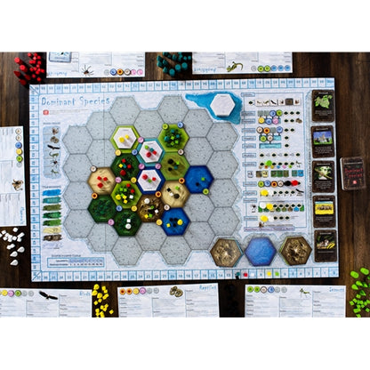 Dominant Species Board game setup with hexagonal tiles and game pieces on a wooden surface