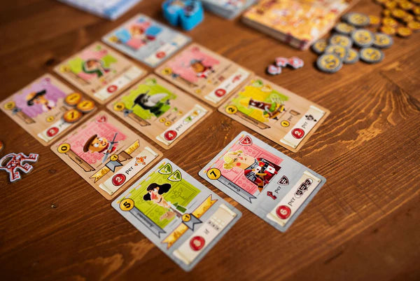 Castle Combo Board game cards with colorful illustrations on a wooden table