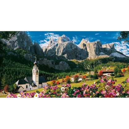 Puzzle Scenic view of a church with mountains in the background