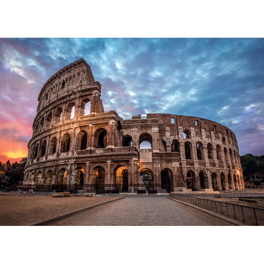 The Colosseum in Rome under a dramatic sky with clouds.