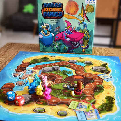 Board game with colorful board and figures, featuring 'Dodos Riding Dinosaurs' packaging.