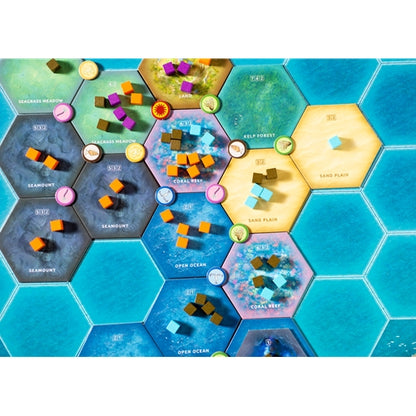 Dominant Species Marine Hexagonal tiles with different landscapes and game pieces on a blue background