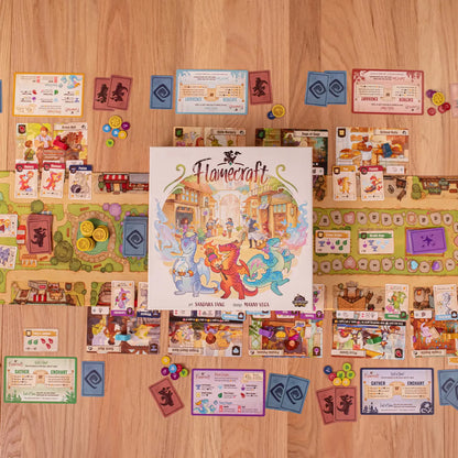 Board game 'Flamecraft' with cards and pieces on a wooden surface