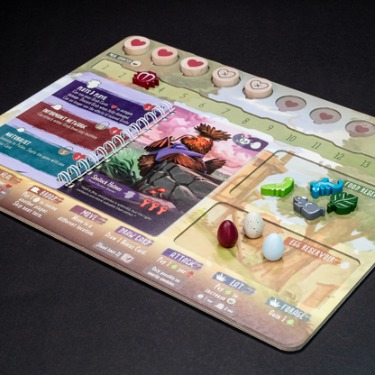 Flock Together Board game component with cards and game pieces on a dark background