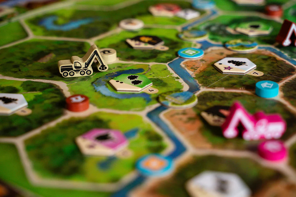 Forestry Board game with player tokens and game pieces on a green board