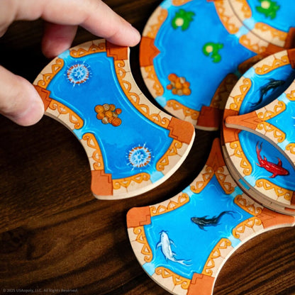 Colorful fish-shaped wooden toys on a wooden surface