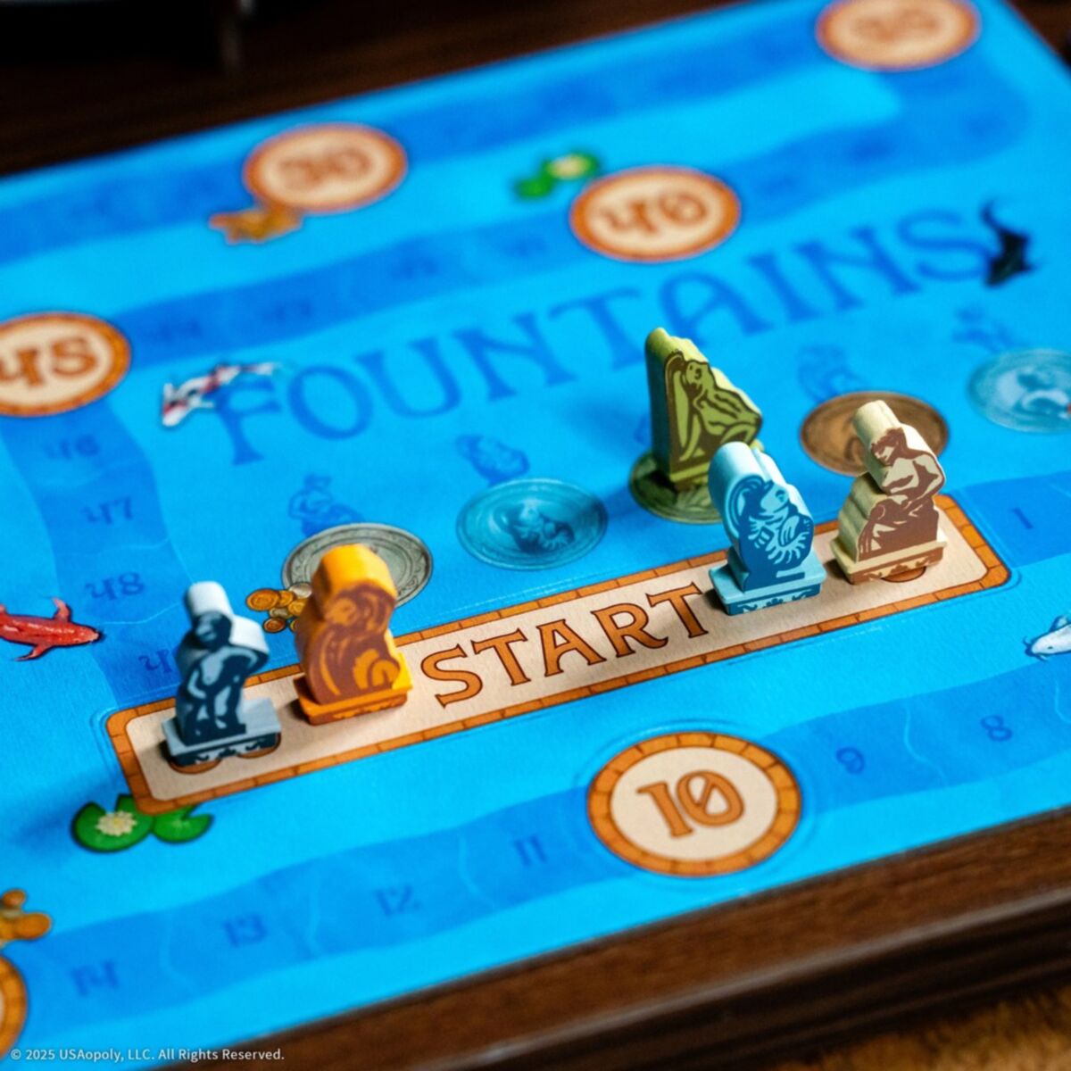 Board game piece on a 'Fountains' board with decorative elements