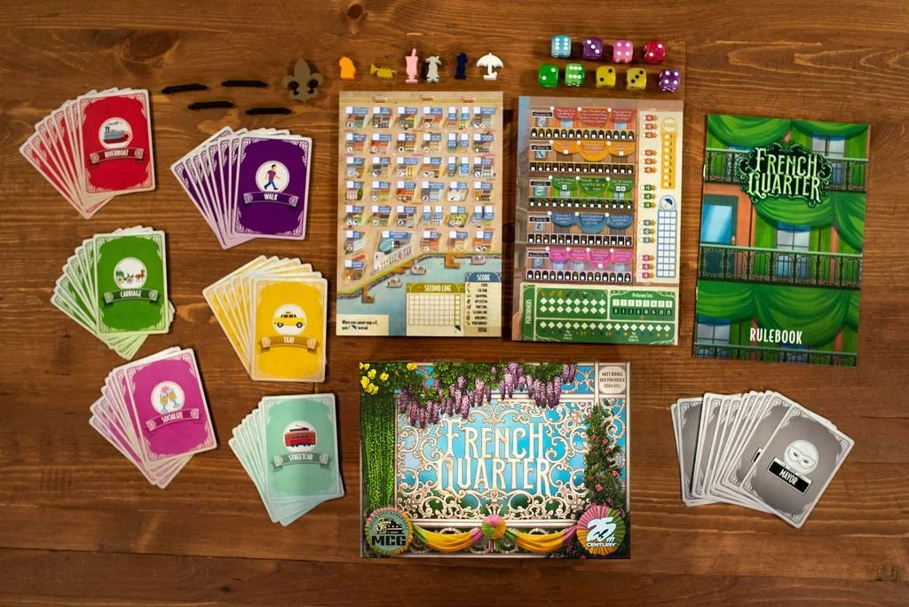 Board game components including cards, board, and pieces on a wooden surface