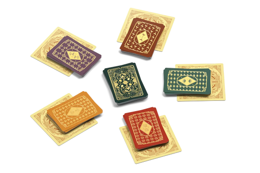 High Society Board Game Set of miniature playing cards with colorful designs on a white background