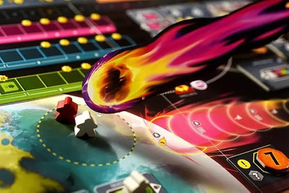 How to save a world A close-up of a colorful board game board with a large fiery projectile graphic in purple, pink, orange, and yellow, along with game pieces and game boards in the background.