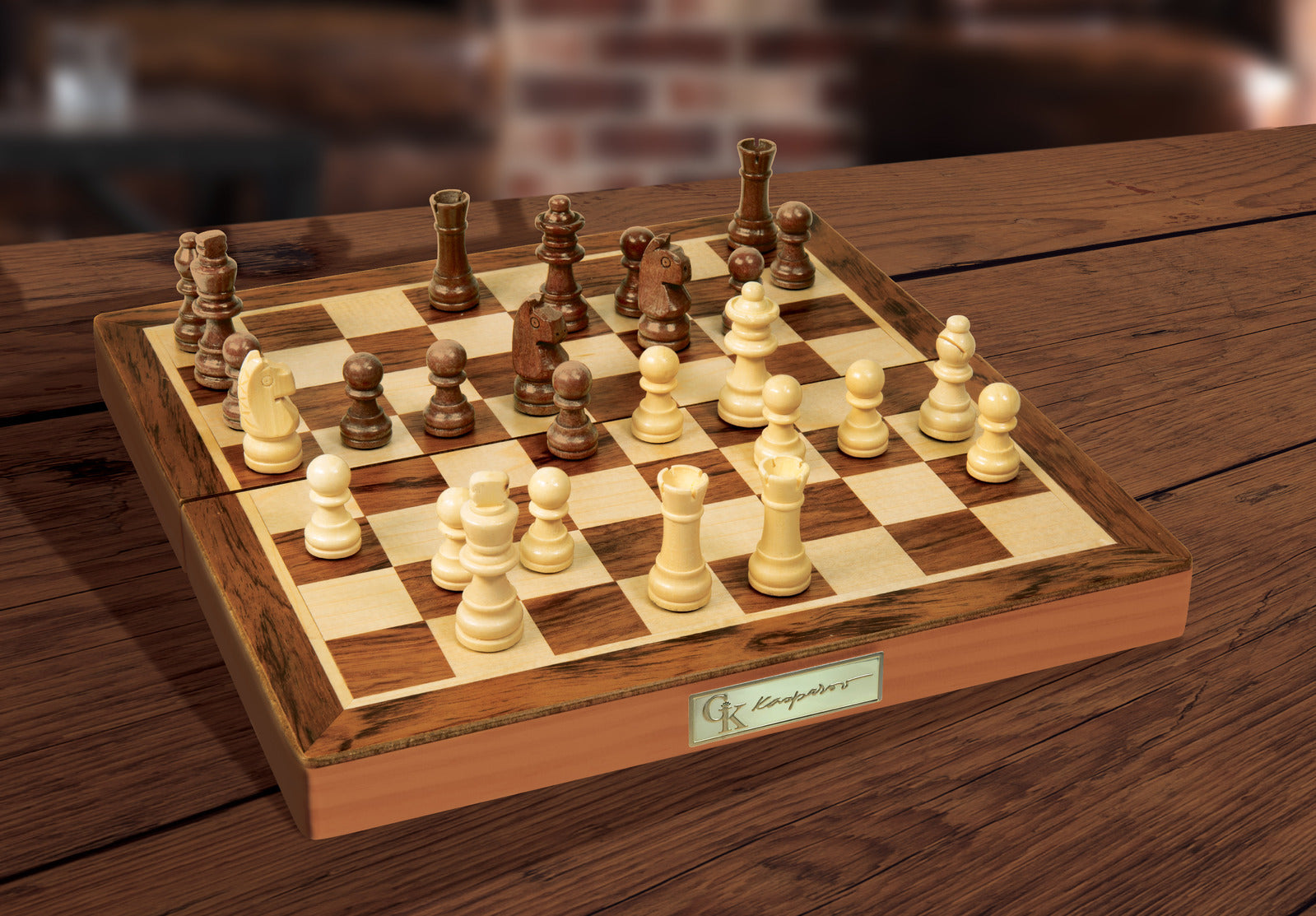 Wooden chessboard with pieces on a wooden table, featuring the brand 'G. A. Longmore'.