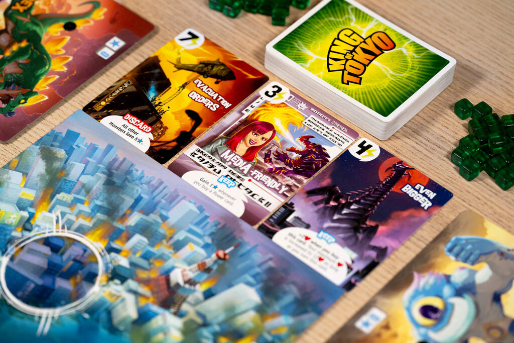 King of Tokyo Colorful board game cards on a wooden surface