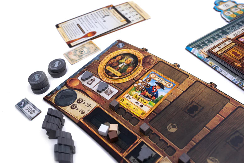 Board game setup with cards, dice, and pieces on a wooden board