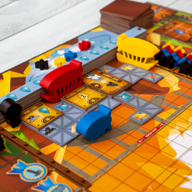 Whistle Mountain Board game with colorful pieces and cards on a wooden table
