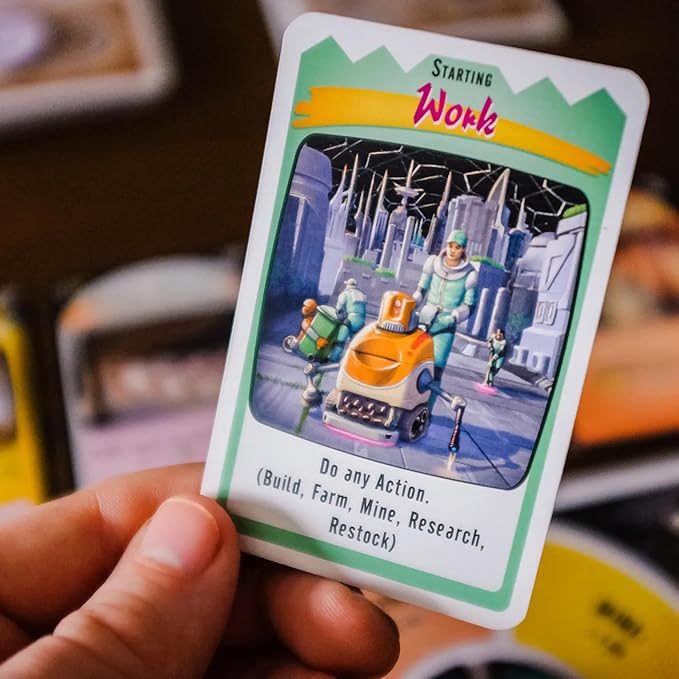 Card with a game illustration and text held by a hand, with a blurred background