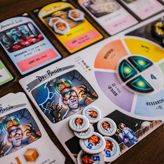 Board game cards with character illustrations and game pieces on a wooden surface