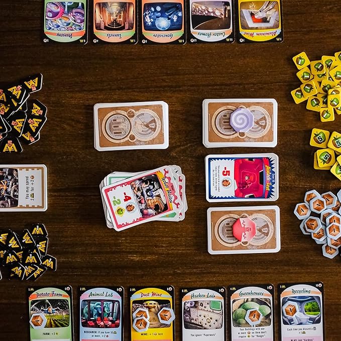 Collection of cards and game pieces on a wooden table