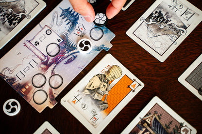 Naishi Playing cards with intricate designs on a wooden surface