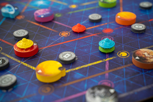 Colorful game pieces on a board with grid lines
