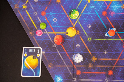 Orbit Board game with space-themed cards and pieces on a dark surface