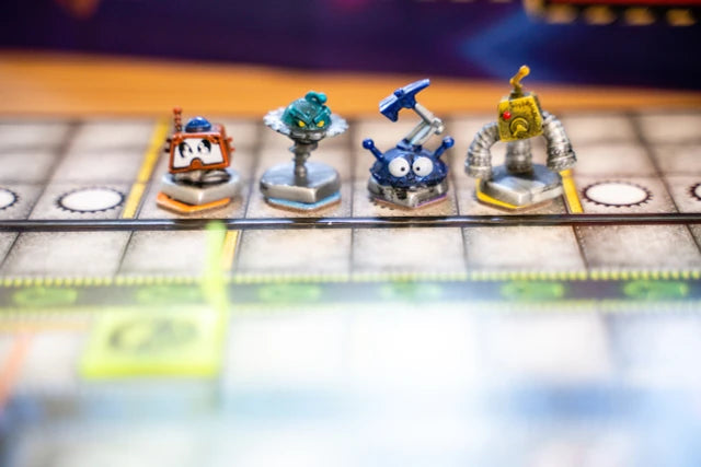 Robo Rally Board game pieces with robot designs on a checkered board