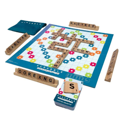 Scrabble game set with tiles and board on a white background