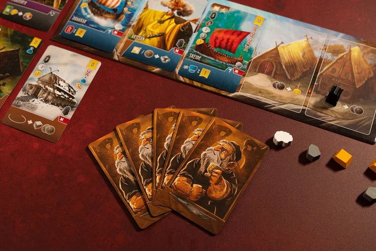 Shipwrights North Sea Board game cards with character illustrations on a red surface