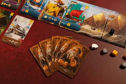 Shipwrights North Sea Board game cards with character illustrations on a red surface