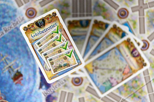 Card game with 'Globetrotter' branding on a map-themed background