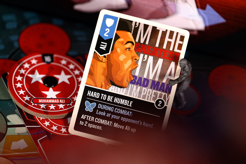 Card featuring a stylized depiction of a famous boxer with text and design elements.