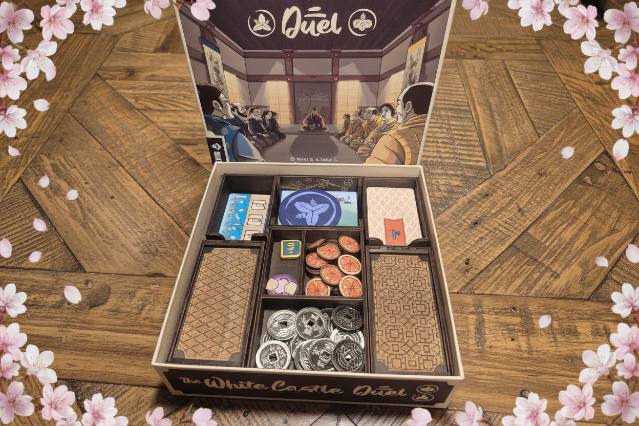 3DLevelup Board game timber organiser for 'The White Castle Duel' with game pieces inside on a wooden surface.