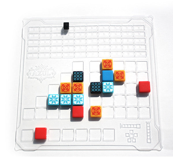 Azul Crystal Mosaic Colorful puzzle blocks on a clear grid board with a white background